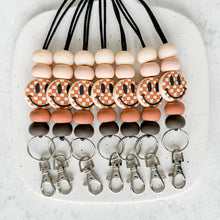 Load image into Gallery viewer, Neutral Checkered Smiley Lanyard