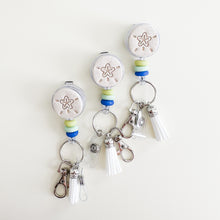 Load image into Gallery viewer, Seaglass and Sand Dollar Badge Reel