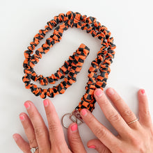 Load image into Gallery viewer, Orange and Black Checker Scrunchie Lanyard