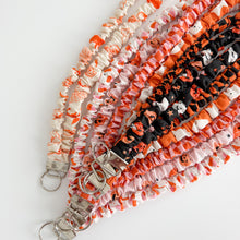 Load image into Gallery viewer, Orange Ghost Gathering Scrunchie Lanyard